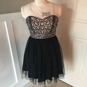 Black strapless Blondie Nites sequin top dress